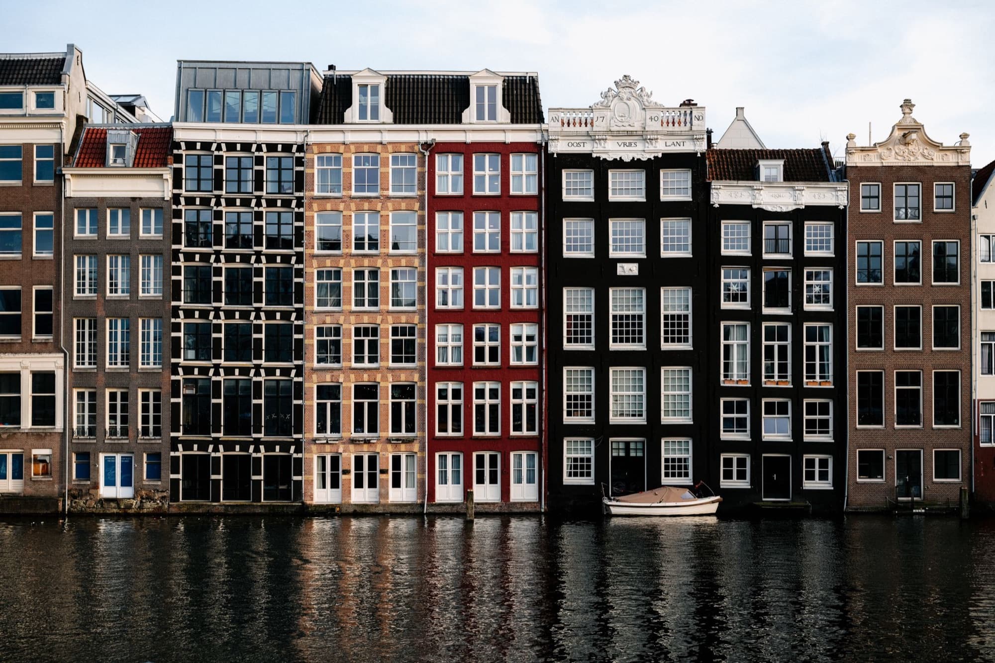 Canal houses along an Amsterdam canal in soft evening light